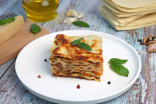 lasagna with basil leaf on plate