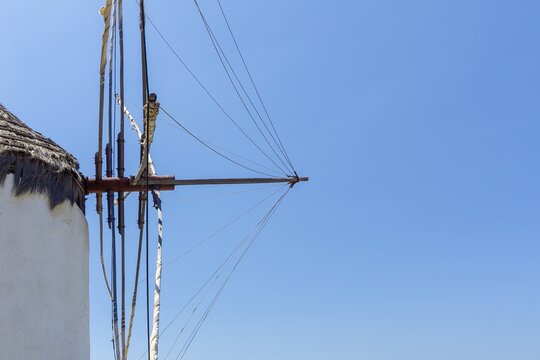 Mykonos windmill structure and ropes against blue sky
