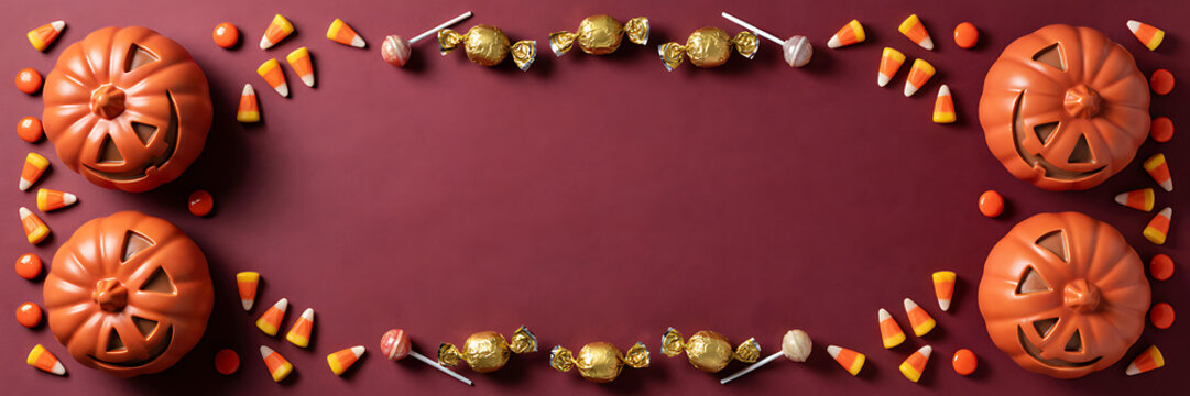 A festive halloween border on a deep maroon background, featuring orange jack-o-lantern, pumpkins, candy corn, lollipops, and gold, wrapped candies