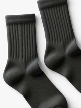Charcoal gray crew socks flat lay mockup on white background. Pair of warm cotton textile garments for winter daily wear. Minimalist clothing object for fashion design retail branding. Soft ribbed