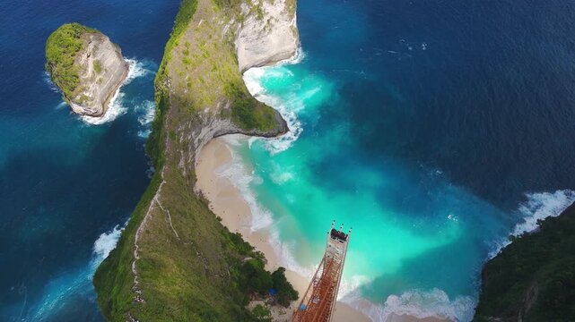 Aerial over Kelingking beach and infamous glass elevator ordered for demolition