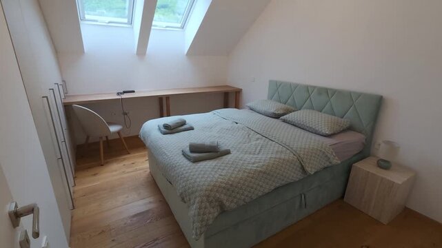 Interior View of Cozy Furnished Bedroom with Double Bed and Skylight Windows. Ideal for Home Interior, Residential Interior, Bedroom, Room, Furniture, Real Estate, Home Design and Vacation Rental