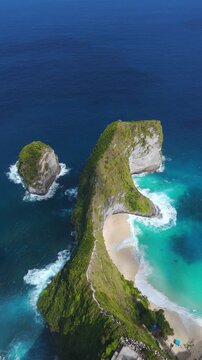 Aerial view of Kelingking Beach T Rex Cliff and its white sand cove in Nusa
