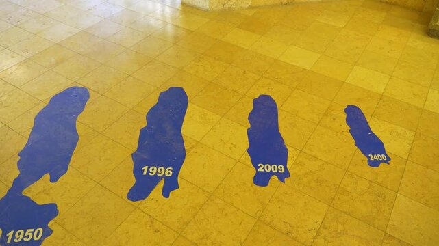 Close-up, Museum display at the Dead Sea Panorama Complex in Jordan illustrates the dramatic shrinking of the Dead Sea over time through changing shoreline outlines and future projections
