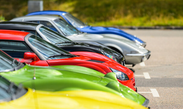 Trollh&auml;ttan, Sweden - August 22 2026: Colorful sports cars lined together during sunny classic automobile gathering.