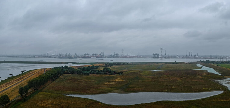 Beveren-Kruibeke-Zwijndrecht, Belgium - 18 August 2026: Aerial view of the Doel Nuclear Power Plant and industrial port infrastructure along the Scheldt river.