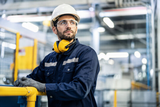 Industrial Worker Wearing Safety Helmet and Protective Clothing