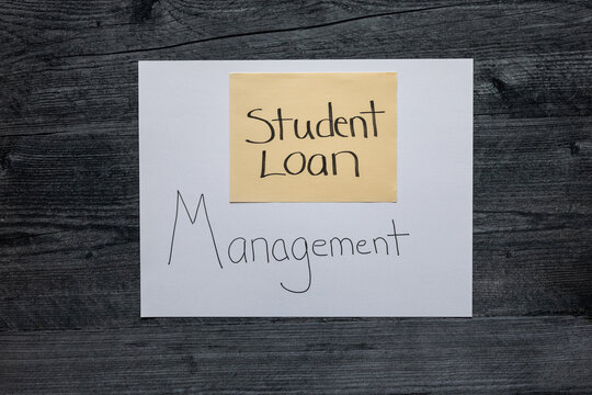 Student Loan Management hand written on paper a flat lay background.