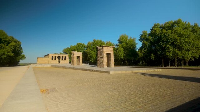 Wide shot of the Temple of Debod, an ancient Egyptian temple rebuilt in Madrid, Spain. Suitable for travel documentaries and cultural heritage content.