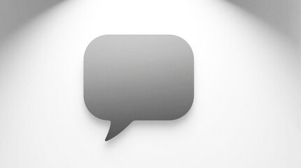 Naklejka premium Minimalist grey speech bubble icon isolated on clean white backdrop. Graphic symbol for chat communication message concepts. Simple abstract shape.