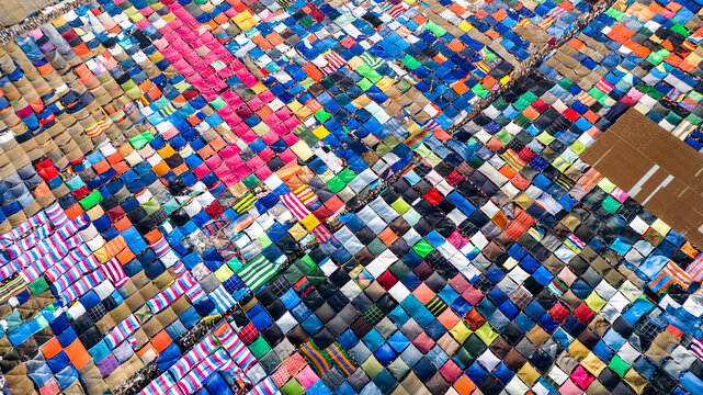 Aerial view of massive Bishwa Ijtema gathering in Tongi, featuring thousands of colorful tents and tarps covering the ground in a dense, vibrant pattern in Tongi, Dhaka Division, Bangladesh.