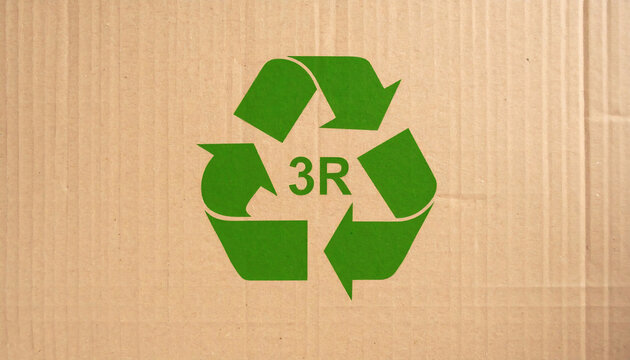 Recycling symbol 3R printed on brown corrugated cardboard texture background representing environmental sustainability and eco friendly waste management practices