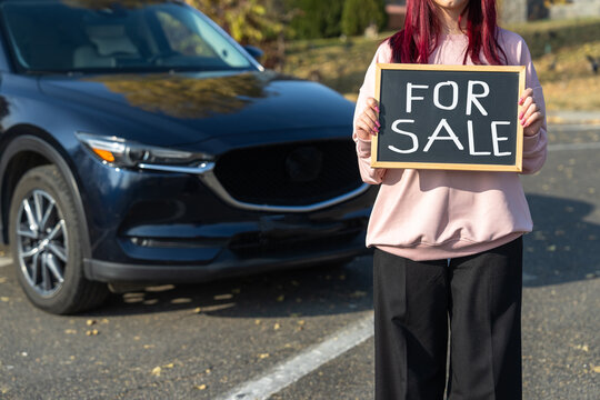 Car for sale advert on a sign