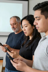 Naklejka premium Digital distraction and smartphone addiction, diverse group of people focused on their mobile phones in a modern classroom setting