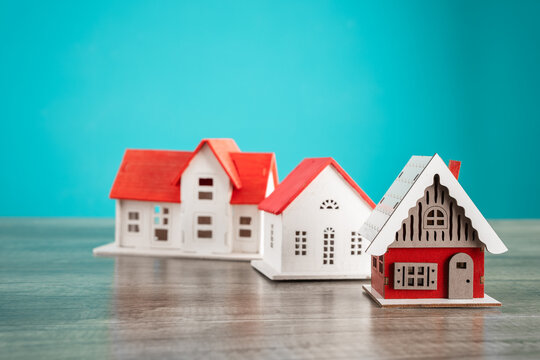 prices on the real estate market, houses with mortgages and models of wooden houses
