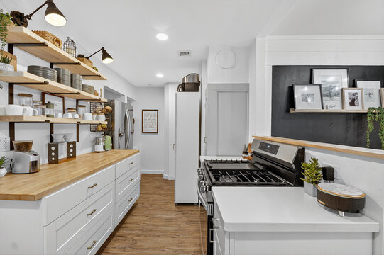 sleek city dwelling kitchen showcasing minimalist aesthetics with practical workspace and decorative elements