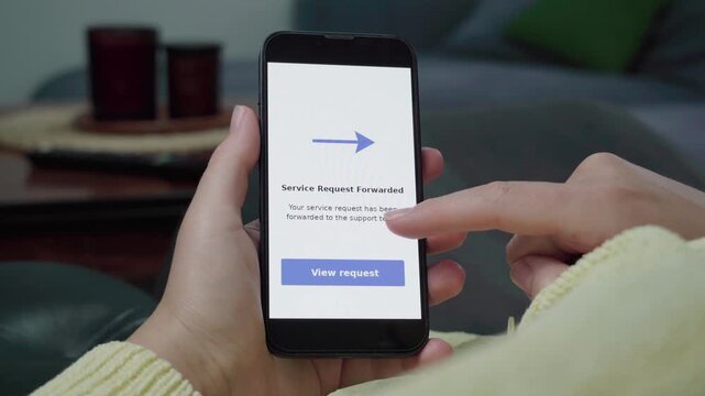 User reads a Service Request Forwarded confirmation on a mobile support portal and taps the View request call-to-action.