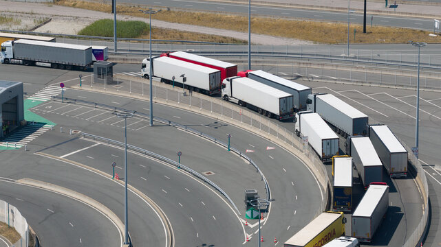 Calais, Hauts-de-France, France - 09 July 2026: Aerial view of Border Checkpoint and Trucks Waiting for Ferry to UK