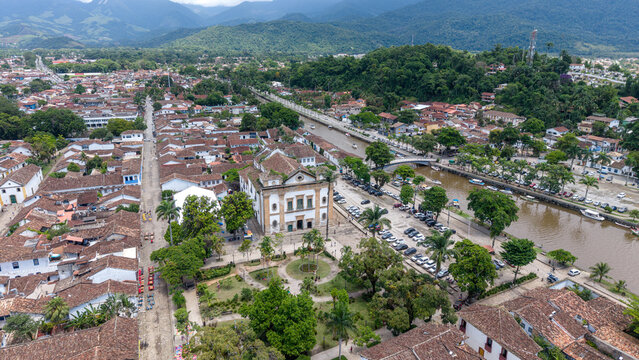Aerial view of the historic center of Paraty, featuring the Church of Our Lady of the Remedies, colonial architecture, cobblestone streets, and the river in Paraty, Rio de Janeiro, Brazil.