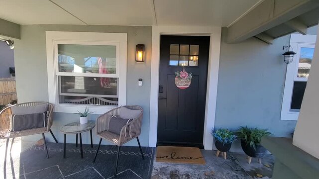 Cozy suburban porch seating at a sunny front entry