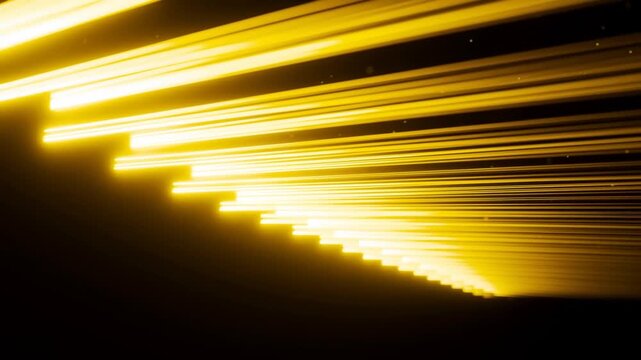 Golden Light Streaks Forming Layered Lines Against Black Abstract Background