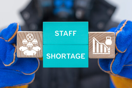 Industry сoncept of staffing shortages. Labor market crisis and recruitment challenges, magnifying glass over industrial human resources.