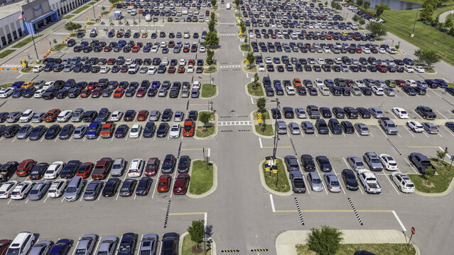 Mt. Juliet, Tennessee, United States - 13 August 2026: Aerial view of the parking lot filled with cars at the Amazon Fulfillment Center, featuring organized rows.