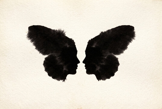 Inkblot Butterfly Silhouette on Paper with Copy Space