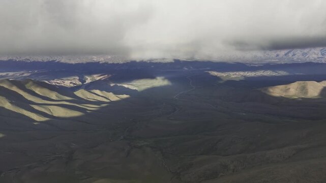 Golden Andes foothills beneath storm clouds in Jujuy, Argentina