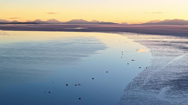 Sunset reflection on Salar de Uyuni salt flat, Bolivia