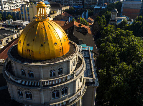 a stunning golden dome on a historic European-style building in Wuhan. Built during the Hankou concession era, this grand architectural landmark contrasts with the modern city.