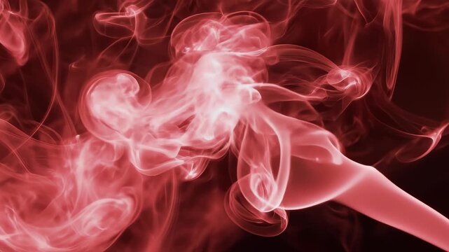 Mesmerizing red smoke swirls and curls in fluid motion captured in ultra hd