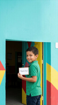 Child delivers a small donation at a colorful community center