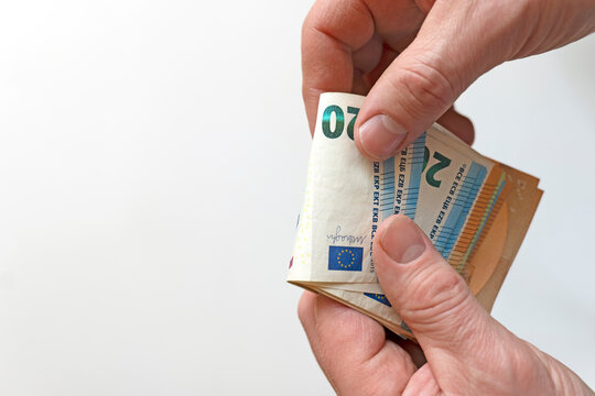 Euro banknotes.Person Holding Twenty Euro Banknotes.Lots of euro banknotes in palms. Money fan in hands