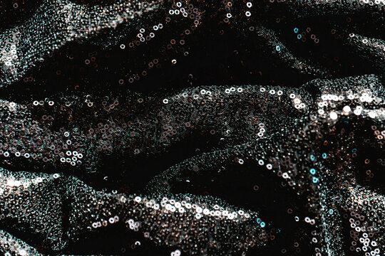 Black Sequin Fabric Texture. Black Friday background. Discounts and sales background. 