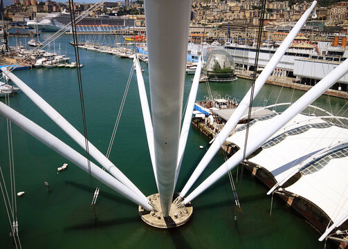 Genova, Liguria, Italy - 19 July 2009: Aerial view of the Bigo structure at Porto Antico di Genova, featuring the harbor, the Biosphere, and the historic city waterfront.