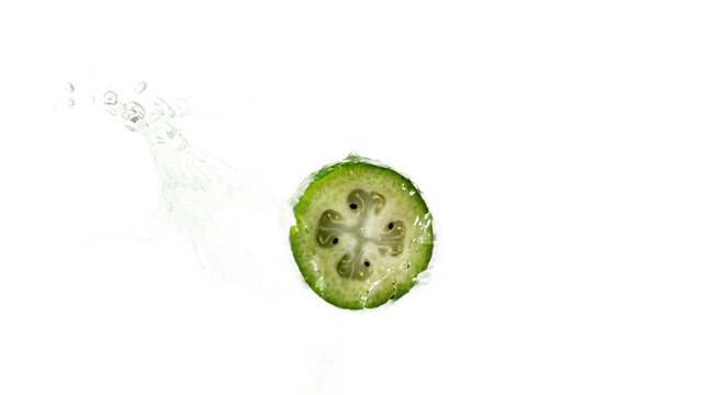 Fresh Feijoa Fruit Slice with Water Splash Isolated on White Background