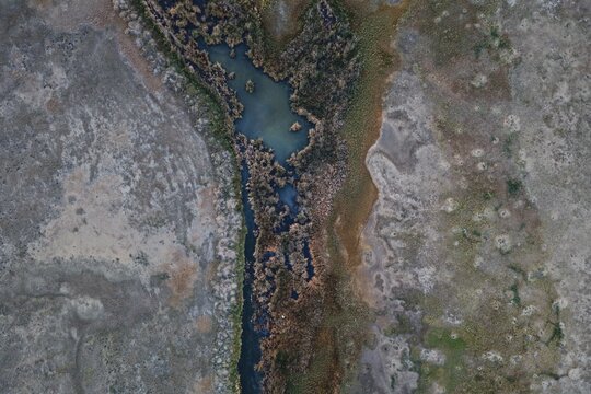 Aerial view of the marshy shoreline and water of Boulder Reservoir in Boulder, Colorado, United States.