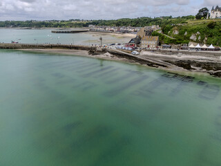 Aerial drone view of underwater oyster farms in Cancale, Brittany, covered during high tide, raditional sustainable aquaculture and production of premium French oysters, France © barmalini