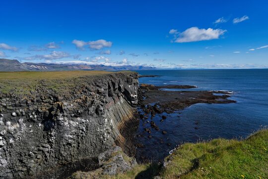 Cliff coastline between the villages of Hellnar and Arnarstapi in western Iceland.