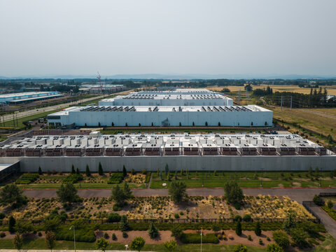 Aerial view of the Hillsboro data centers featuring large industrial buildings with extensive rooftop cooling units and surrounding landscaped grounds in Hillsboro, Oregon, United States.
