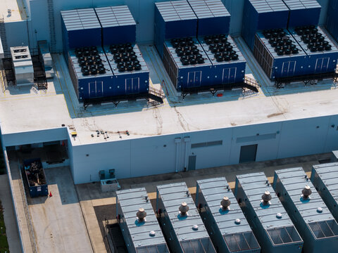 Aerial view of Hillsboro data centers featuring large industrial cooling units and HVAC systems on the rooftop in Hillsboro, Oregon, United States.