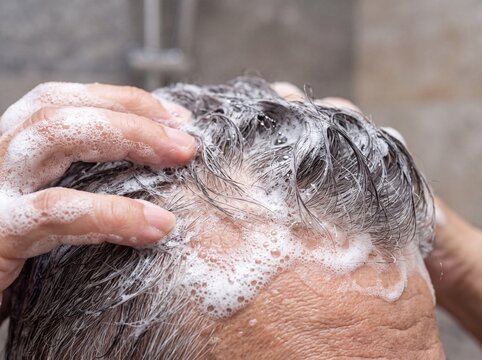 Macro Detail of Shampoo Lather and Grey Hair Texture
