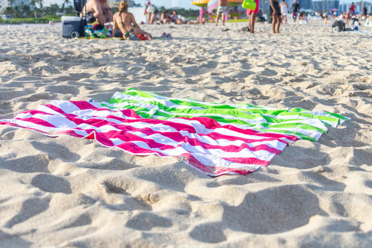 Two towels for sunbath on beautiful beach surface background ,travel landscape clean white sand