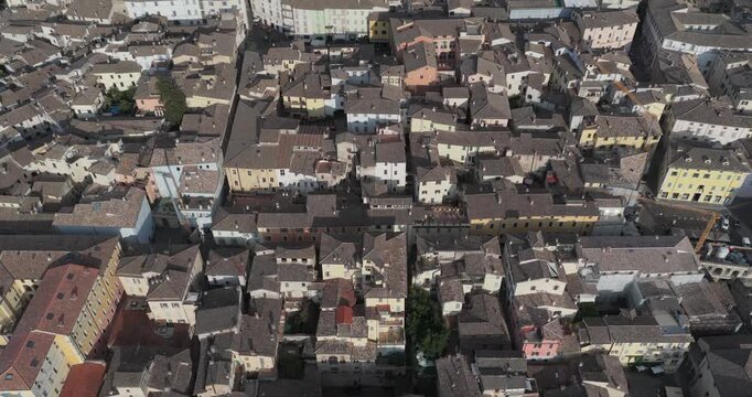 Aerial view of historic rooftops and narrow streets in Spoleto, Umbria, Italy.
