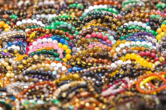 Mixed colors beads close-up made from natural stones or glass marbles