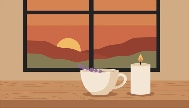 Warm cup of tea with lavender rests on a wooden table beside a tall pillar candle overlooking a picturesque sunset landscape.