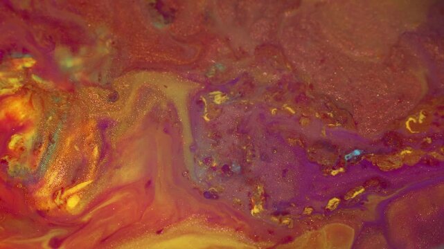 Liquid paint footage. Abstract Cinematic Motion Macro Acrylic Footage Background in Red Gold Magenta Pink Yellow