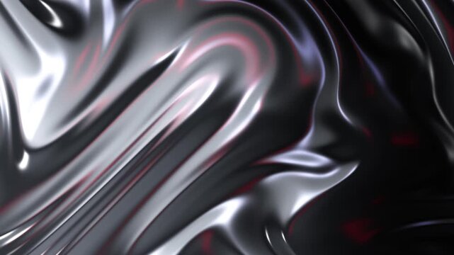 Abstract liquid metal wave with glossy black surface and colorful reflections in slow motion.
