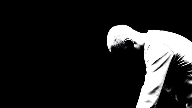 High Contrast Black and White Looping Animation of a Man Bowing Head in Solitude
